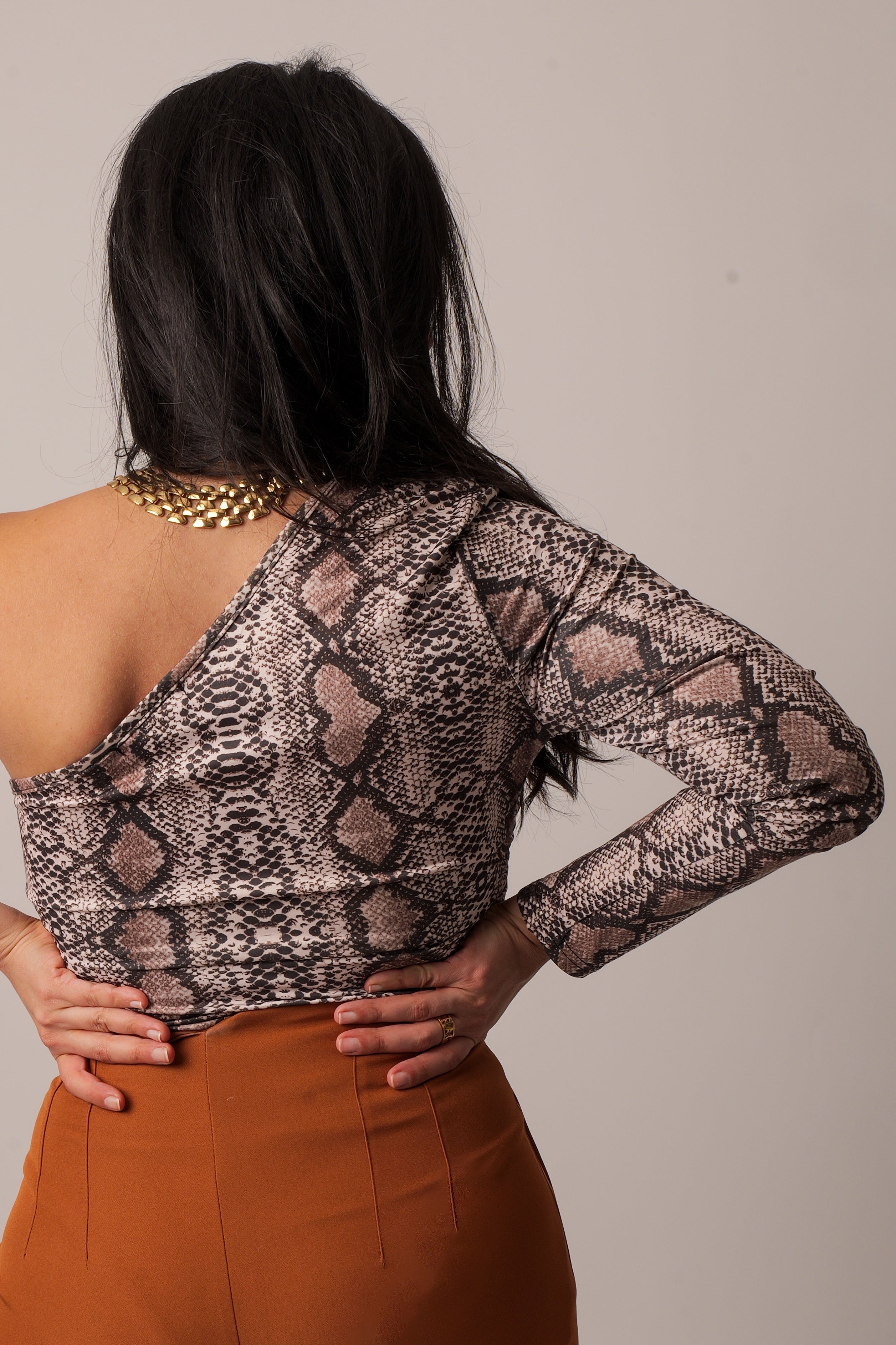 One shoulder snake print bodysuit.